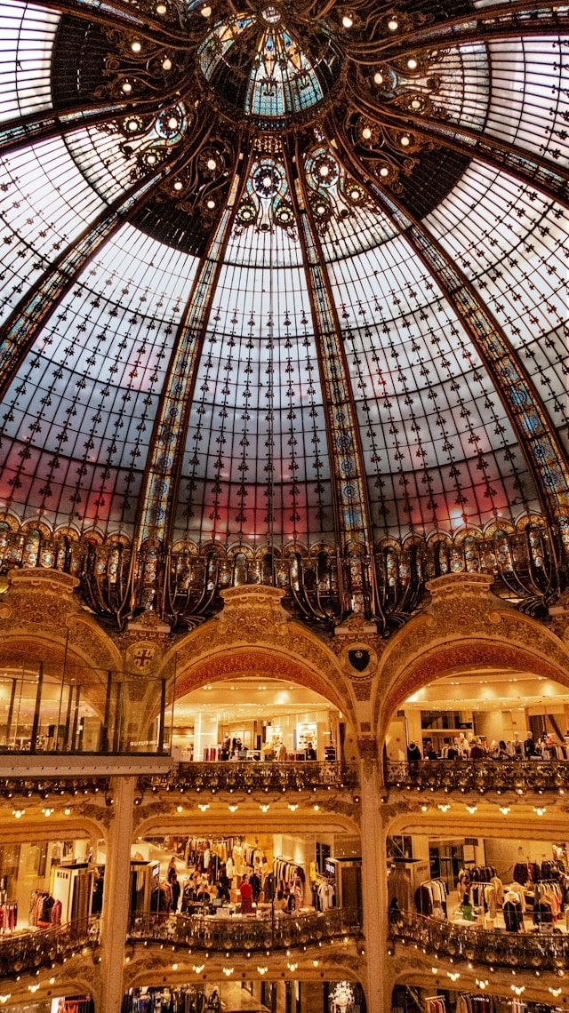 Ornate stained-glass dome of a grand luxury department store
