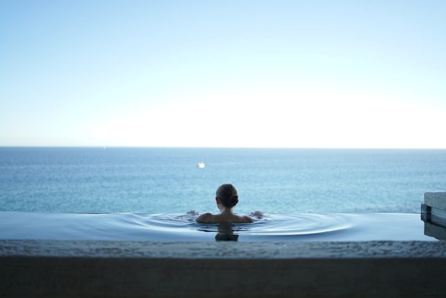 Infinity pool overlooking the ocean at a luxury wellness retreat